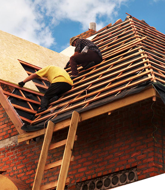 Image of men roofing a house